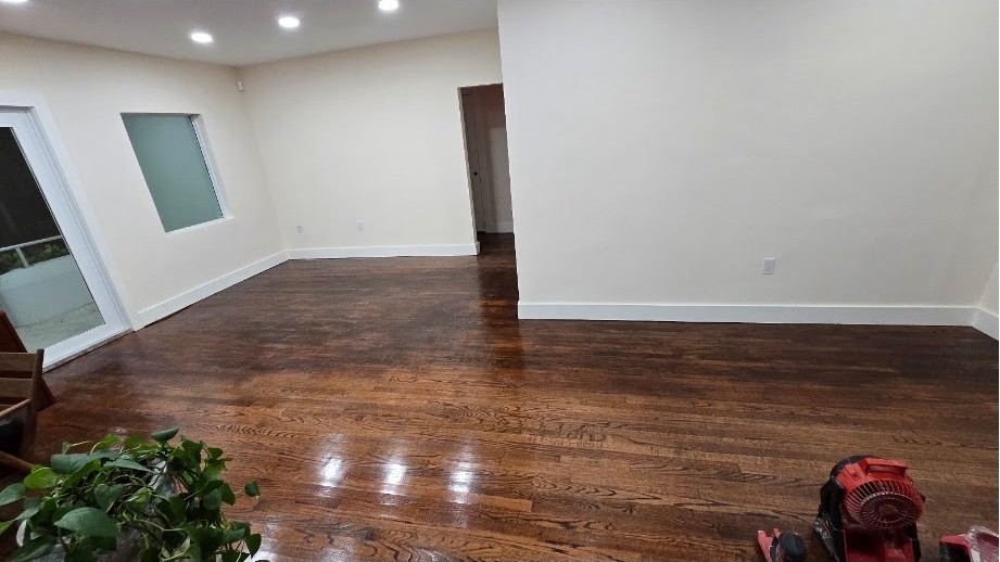 Finished hardwood flooring in a bright room